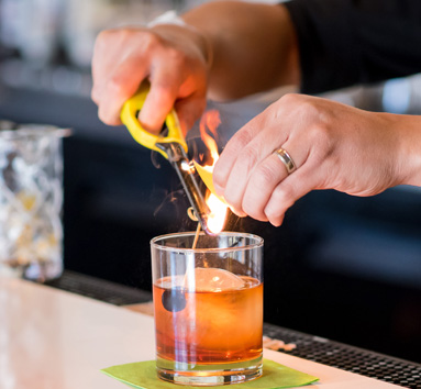 Bartender Making a Cocktail With Fire